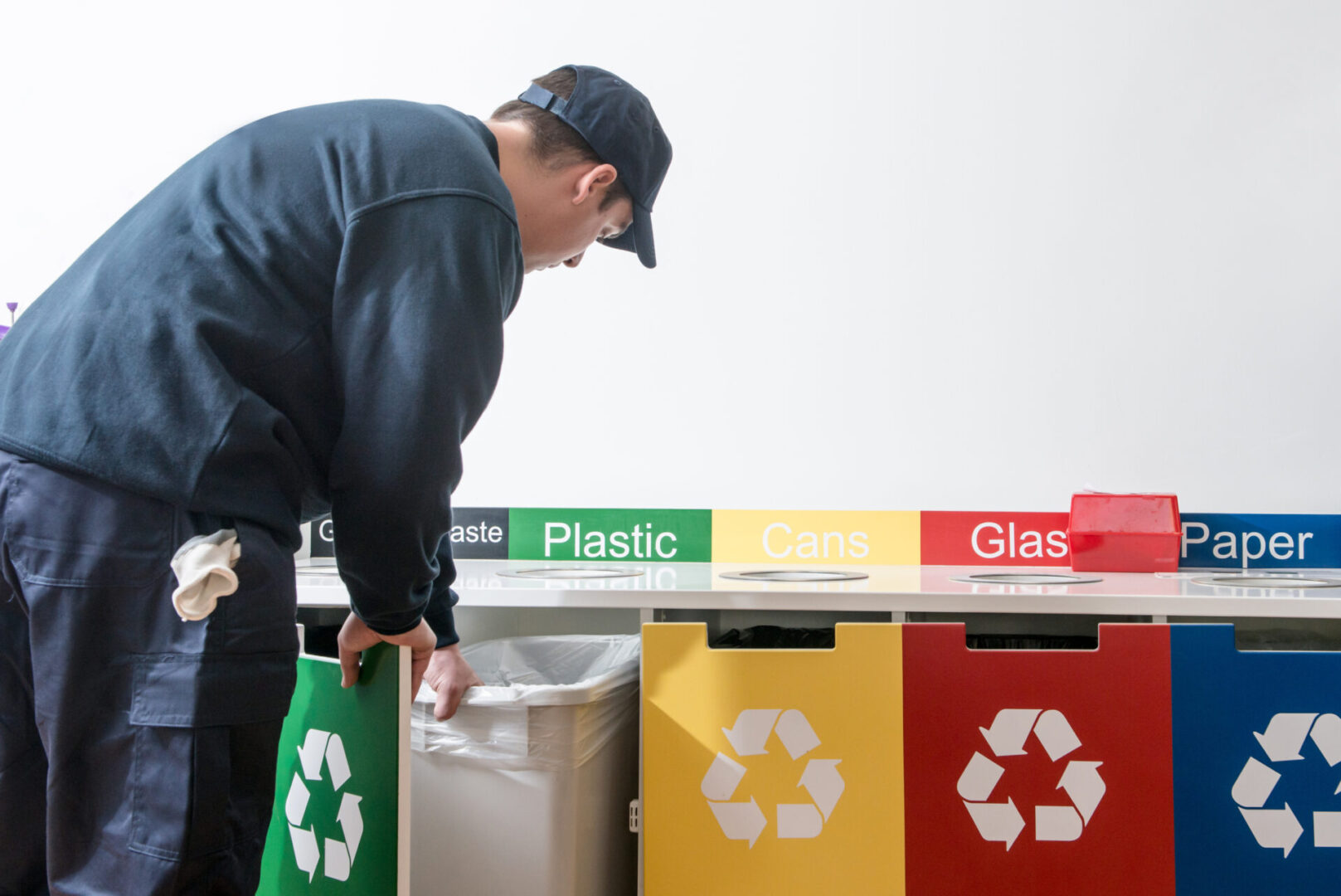 Man collecting paper in an office for recycling